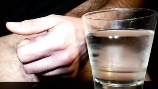 Closeup Thick Ejaculation Into a Glass of Cold Water
