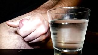 Closeup Thick Ejaculation Into a Glass of Cold Water