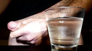 Closeup Thick Ejaculation Into a Glass of Cold Water