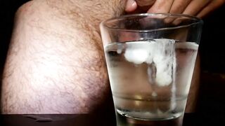 Closeup Thick Ejaculation Into a Glass of Cold Water