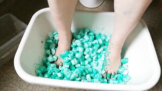 Joy with packing peanuts and green paint