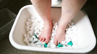 Joy with packing peanuts and green paint