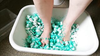 Joy with packing peanuts and green paint
