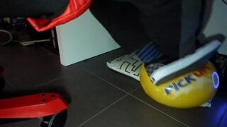 Boy shoeplay and stomping stuff at home in Nikes, Vans, blue stiped socks