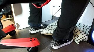 Boy shoeplay and stomping stuff at home in Nikes, Vans, blue stiped socks