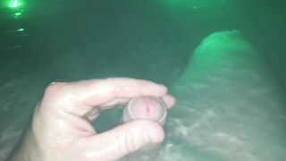 Underwater wank session in backyard in steamy sexy tub glowing at night.