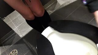 Rear View Urinate At The Cinema