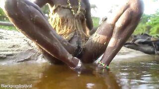 Hawt slender Afro village woman bathing and teasing in a river