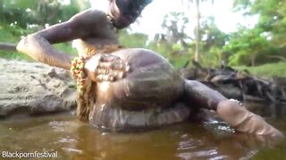 Hawt slender Afro village woman bathing and teasing in a river