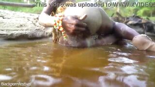 Hawt slender Afro village woman bathing and teasing in a river