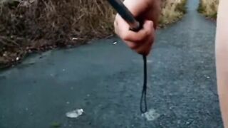 Bare with and out of jock pump at side of busy road
