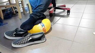 Boy Shoeplay with beach ball in Underneath Armor, Vans Slide Ons, Ebony Socks