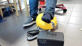 Boy Shoeplay with beach ball in Underneath Armor, Vans Slide Ons, Ebony Socks