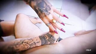 Close-up masturbation with tattooed hands and ring friction.