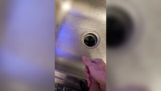 Bawdy urinate into the kitchen sink