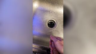 Bawdy urinate into the kitchen sink