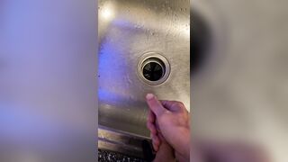 Bawdy urinate into the kitchen sink