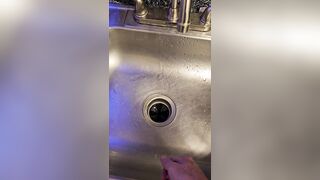 Bawdy urinate into the kitchen sink
