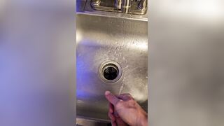 Bawdy urinate into the kitchen sink