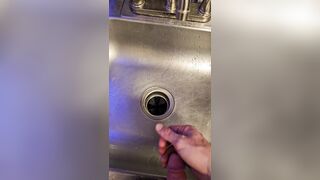 Bawdy urinate into the kitchen sink