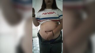 big beautiful woman playing with massive stomach whilst smokin'