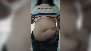 big beautiful woman playing with massive stomach whilst smokin'