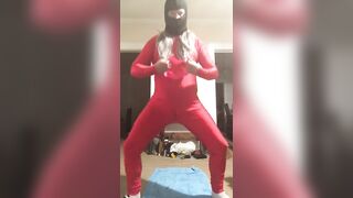 Yoga resistance band wearing red spandex and wig (Raunchy Edition)