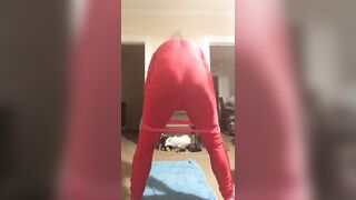 Yoga resistance band wearing red spandex and wig (Raunchy Edition)