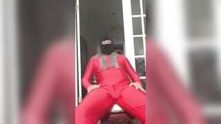 Yoga resistance band wearing red spandex and wig (Raunchy Edition)
