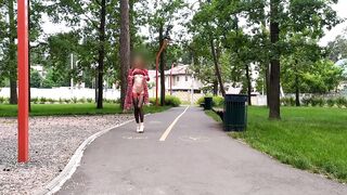 Sluty teen beauty walks in the park in a micro suit out of pants (upskirt, no pants, nylons)